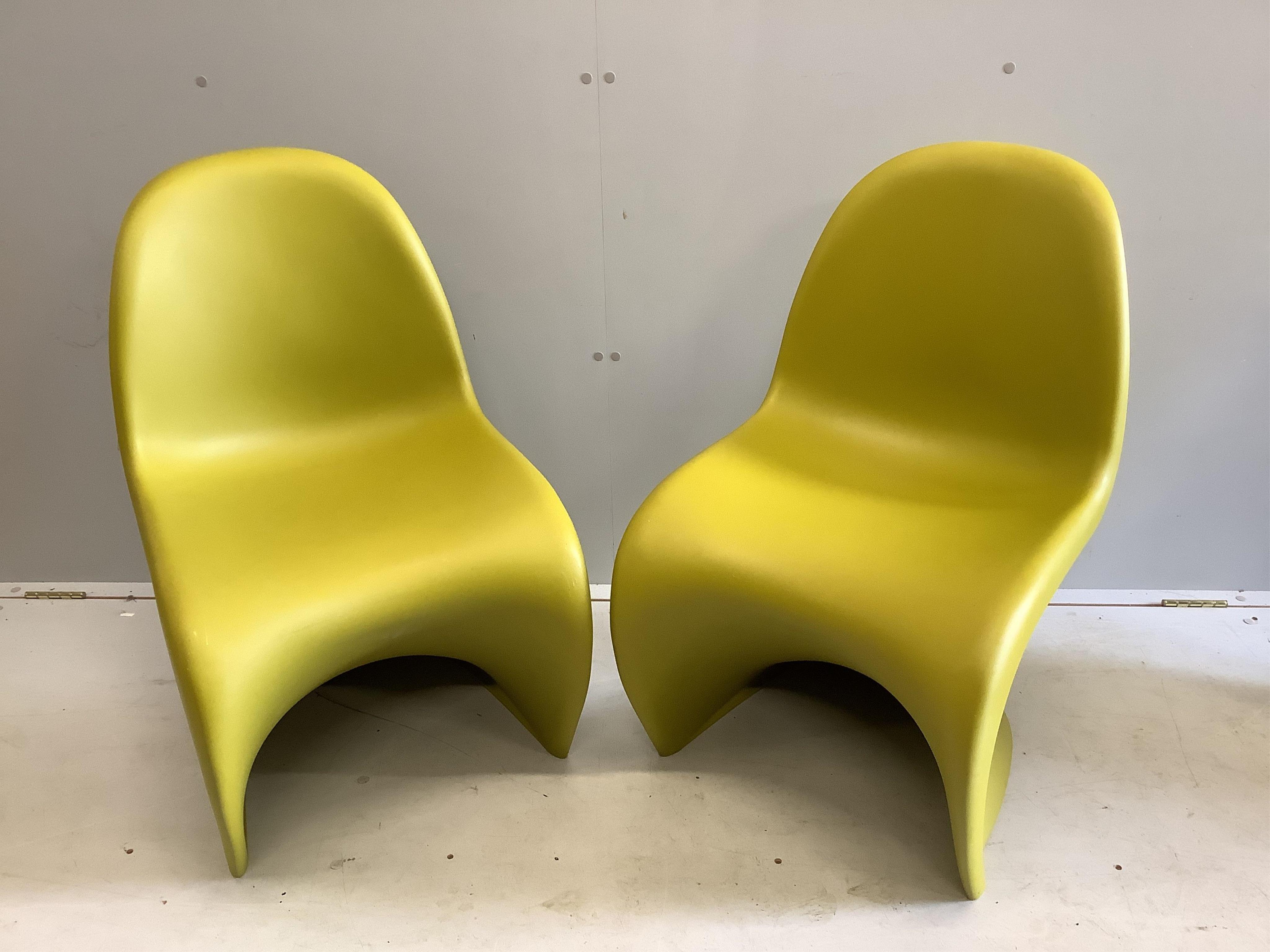 Two moulded plastic chairs by Verner Panton for Vitra, width 48cm, depth 58cm, height 82cm